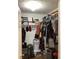 Spacious walk-in closet fully equipped with clothing, shoes, and storage containers at 2546 Tullamore Cir, Snellville, GA 30039