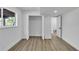 Well-lit bedroom features a closet, a window view of nature, and white walls and trim at 353 Colchester Dr, Stone Mountain, GA 30088