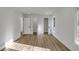 Sunlit bedroom features neutral walls, modern flooring, and multiple closets/doorways for functionality and spaciousness at 353 Colchester Dr, Stone Mountain, GA 30088