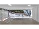 A large carport offers covered parking with room for extra storage and access to a wooded backyard at 353 Colchester Dr, Stone Mountain, GA 30088