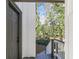 This view looks from inside to the wood exterior with steps leading down to a wooded backyard at 353 Colchester Dr, Stone Mountain, GA 30088