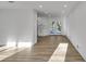 Spacious, naturally lit living room featuring modern flooring and access to the outside at 353 Colchester Dr, Stone Mountain, GA 30088