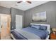 A calming bedroom with grey walls, fan, and a doorway leading to the on-suite bathroom at 870 Inman Village Ne Pkwy # 222, Atlanta, GA 30307
