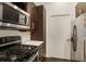 This kitchen features stainless steel appliances, dark cabinets, and white countertops at 870 Inman Village Ne Pkwy # 222, Atlanta, GA 30307