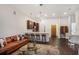 Inviting living room featuring a modern kitchen, island seating, and a comfortable leather sofa at 870 Inman Village Ne Pkwy # 222, Atlanta, GA 30307