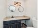 Contemporary bathroom features a sleek vanity with granite counters, vessel sink, and black fixtures at 122 Belmonte Sw Dr, Atlanta, GA 30311