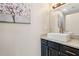 Stylish powder room with vessel sink, granite countertop, and modern fixtures at 122 Belmonte Sw Dr, Atlanta, GA 30311