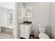 Bathroom with modern vanity and mirror, and a tiled shower at 122 Belmonte Sw Dr, Atlanta, GA 30311