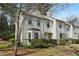 Charming townhouse with landscaped front yard, natural light, and inviting curb appeal at 122 Belmonte Sw Dr, Atlanta, GA 30311