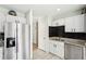 Updated kitchen featuring stainless steel appliances, granite countertops, and ample storage space at 122 Belmonte Sw Dr, Atlanta, GA 30311