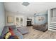 Spacious living room with modern flooring, a cozy fireplace, and access to the outdoor area at 122 Belmonte Sw Dr, Atlanta, GA 30311