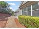 Home features a patio with an outdoor seating area and a view of the landscaped backyard at 1874 Manor View Nw Cir # 4, Acworth, GA 30101