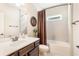 Well-lit bathroom featuring a shower-tub combo, modern fixtures, and neutral tiling at 1874 Manor View Nw Cir # 4, Acworth, GA 30101