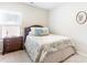 Comfortable bedroom with soft carpeting, a queen-sized bed with a patterned comforter, and a side table at 1874 Manor View Nw Cir # 4, Acworth, GA 30101