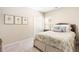 Cozy bedroom featuring plush carpeting, neutral walls, and a comfortable queen-sized bed with soft pillows at 1874 Manor View Nw Cir # 4, Acworth, GA 30101