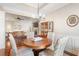 Bright dining room with hardwood floors, stylish chandelier, and access to the living area at 1874 Manor View Nw Cir # 4, Acworth, GA 30101