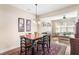 Inviting dining area with an elegant chandelier, adjacent to a bright living room with large windows at 1874 Manor View Nw Cir # 4, Acworth, GA 30101