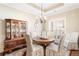 Elegant dining room with a chandelier, classic china cabinet, and seating for six at 1874 Manor View Nw Cir # 4, Acworth, GA 30101