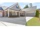 Charming single-Gathering home with a brick and gray siding exterior and manicured lawn at 1874 Manor View Nw Cir # 4, Acworth, GA 30101
