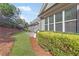 Well-maintained exterior with landscaped yard and views of surrounding greenery from the patio at 1874 Manor View Nw Cir # 4, Acworth, GA 30101