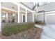 Inviting front porch with brick accents, white columns, and seating area at 1874 Manor View Nw Cir # 4, Acworth, GA 30101