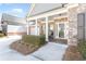 Charming front porch with white columns, brick accents, and seating at 1874 Manor View Nw Cir # 4, Acworth, GA 30101