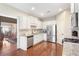 Bright kitchen with stainless steel appliances, granite counters, and hardwood floors at 1874 Manor View Nw Cir # 4, Acworth, GA 30101