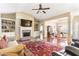 Spacious living room showcasing hardwood floors, fireplace, and open access to the dining area at 1874 Manor View Nw Cir # 4, Acworth, GA 30101