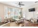 Bright sunroom features hardwood floors, comfortable seating, and plenty of natural light at 1874 Manor View Nw Cir # 4, Acworth, GA 30101