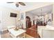 Cozy living room with wicker furniture opens to an eat-in kitchen with white cabinetry at 1874 Manor View Nw Cir # 4, Acworth, GA 30101
