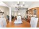 Inviting living room with hardwood floors, columns, fireplace, and a view to the dining room at 1874 Manor View Nw Cir # 4, Acworth, GA 30101