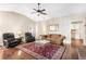 Cozy living room features a ceiling fan, plush seating, and hardwood floors at 1874 Manor View Nw Cir # 4, Acworth, GA 30101