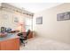 Spacious home office with ample desk space, built-in shelving, and neutral carpeting at 1874 Manor View Nw Cir # 4, Acworth, GA 30101