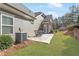 A patio is located just off the rear of the home with a table and chairs and overlooks the backyard at 1874 Manor View Nw Cir # 4, Acworth, GA 30101