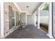 A cozy covered front porch with chairs provides a welcoming entrance to the home at 1874 Manor View Nw Cir # 4, Acworth, GA 30101