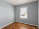 Bedroom with natural light streaming through the window and beautiful hardwood floors at 866 United Se Ave, Atlanta, GA 30312