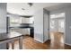 Functional kitchen with white cabinets, stainless steel appliances, hardwood floors and neutral gray walls at 866 United Se Ave, Atlanta, GA 30312