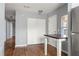 Convenient closet laundry area with a washer, dryer, shelving, and hardwood floors at 866 United Se Ave, Atlanta, GA 30312