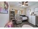 Cozy bedroom with crib, rocking chair, built-in shelves, and decorative artwork at 121 Fox Wood Ct, Villa Rica, GA 30180