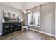 Elegant dining room with wood floors, large window, and modern chandelier at 121 Fox Wood Ct, Villa Rica, GA 30180