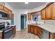 Traditional kitchen with wooden cabinets, stainless steel appliances, and tile backsplash at 121 Fox Wood Ct, Villa Rica, GA 30180