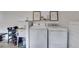 Well-equipped laundry area featuring washer, dryer, and utility sink at 121 Fox Wood Ct, Villa Rica, GA 30180