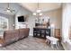 Stylish living room featuring a fireplace, entertainment center, and ample natural light at 121 Fox Wood Ct, Villa Rica, GA 30180