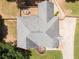 Birds eye view of the property, highlighting the roof, deck, driveway, and landscaping at 2515 Little John Ct, Cumming, GA 30040