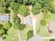 Aerial shot of the property, displaying the location in a neighborhood with mature trees and well-maintained lawns at 2515 Little John Ct, Cumming, GA 30040
