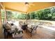 Relaxing covered back porch provides ample seating and serene views of the landscaped backyard at 2515 Little John Ct, Cumming, GA 30040
