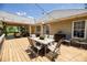 Spacious covered back porch with string lights offers outdoor dining and entertaining space at 2515 Little John Ct, Cumming, GA 30040