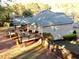 Expansive backyard features a wooden deck perfect for entertaining or relaxing in a private, fenced yard at 2515 Little John Ct, Cumming, GA 30040