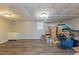 Spacious basement with wood-look flooring, utility sink, and window offers versatile potential at 2515 Little John Ct, Cumming, GA 30040