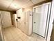 Finished basement offering cabinetry for storage, tiled floors, and good lighting at 2515 Little John Ct, Cumming, GA 30040